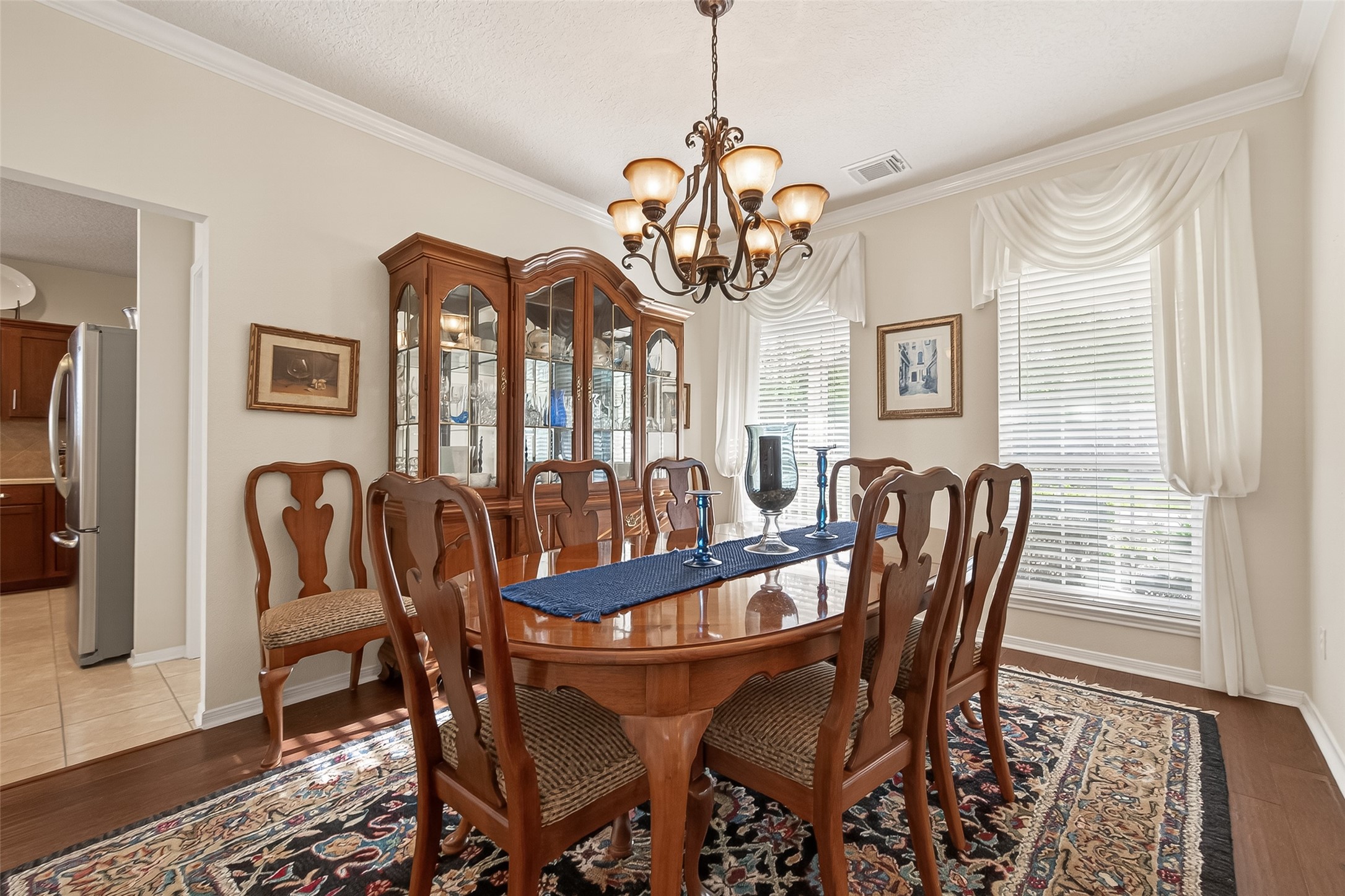 522 Beauregard Drive Conroe, TX 77302 - Photo 10 of 50 a view of a dining room with furniture window and wooden floor