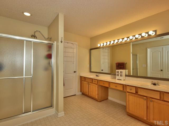 317 Grassy Point Road Apex, NC 27502 - Photo 15 of 25 Huge master bath with soaker tub, separate walk in shower and framed mirror..