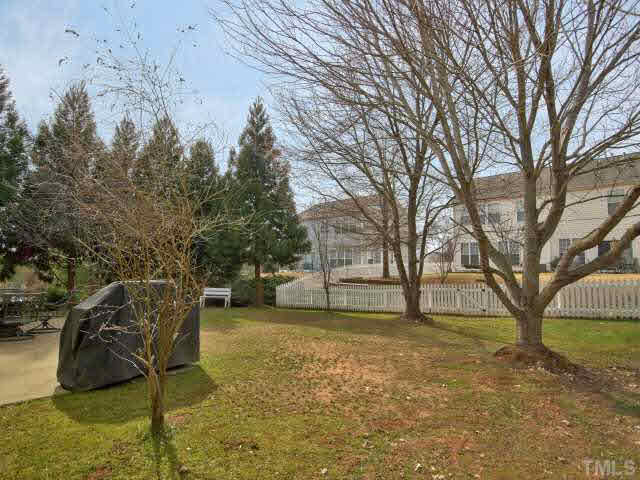 317 Grassy Point Road Apex, NC 27502 - Photo 21 of 25 Big, flat back yard and oversized patio!