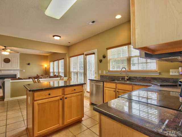 317 Grassy Point Road Apex, NC 27502 - Photo 25 of 25 Kitchen overlooks breakfast room and family room in this open floorplan.