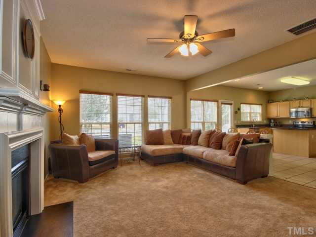 317 Grassy Point Road Apex, NC 27502 - Photo 6 of 25 Large family room with gas fireplace.