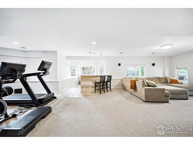 a living room with furniture a table and chairs