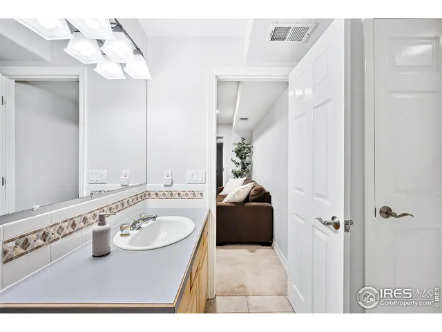 a bathroom with a sink double vanity and a mirror