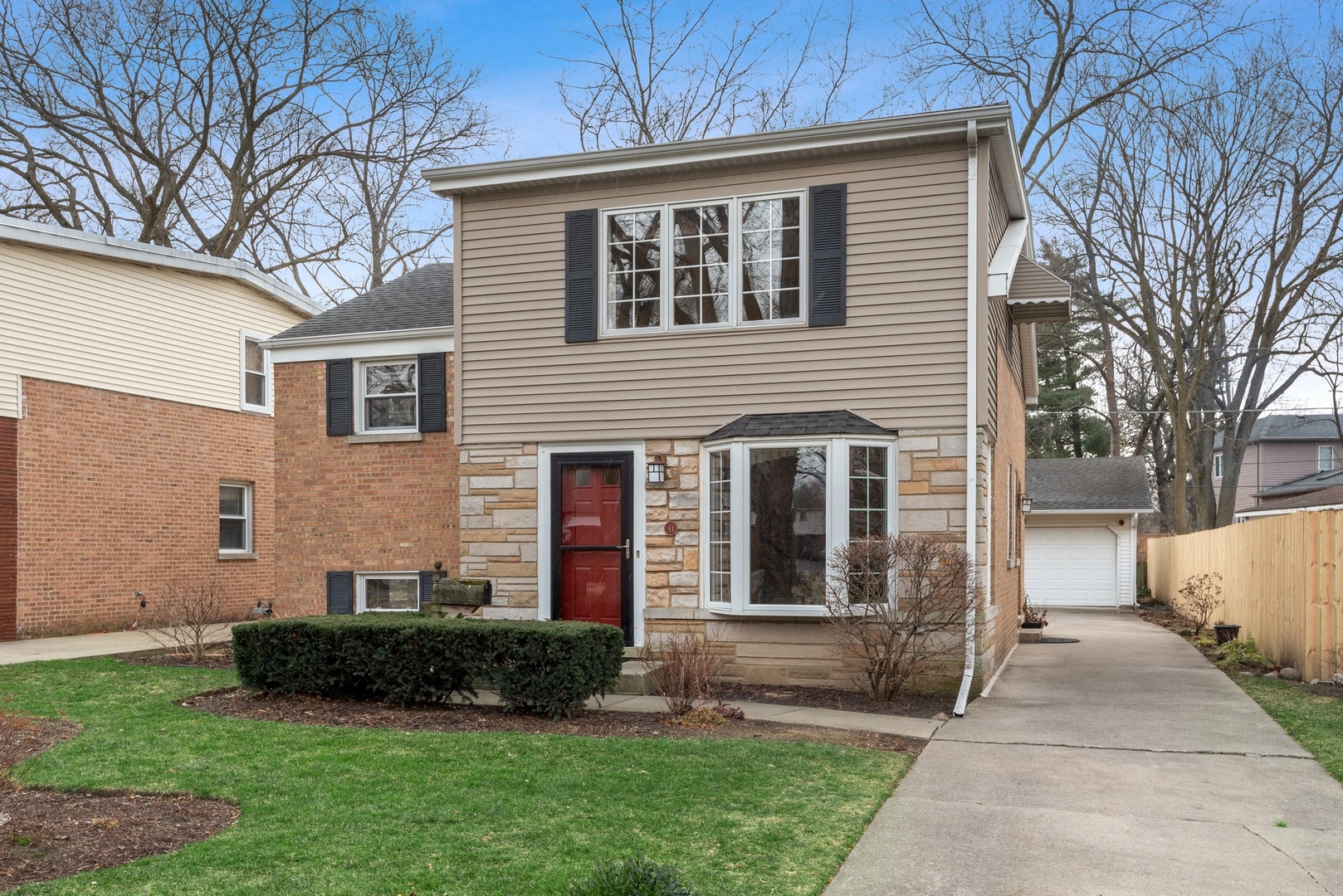 41 Hackberry Lane Glenview, IL 60025 - Photo 1 of 21 a front view of a house with a garden and plants