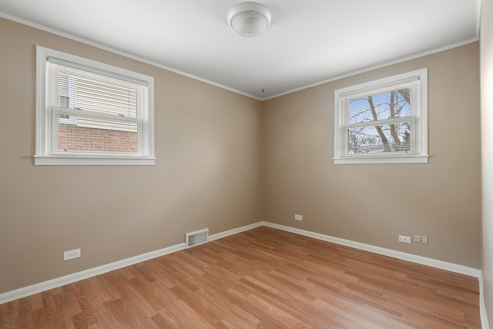 41 Hackberry Lane Glenview, IL 60025 - Photo 17 of 21 a view of an empty room with wooden floor and a window
