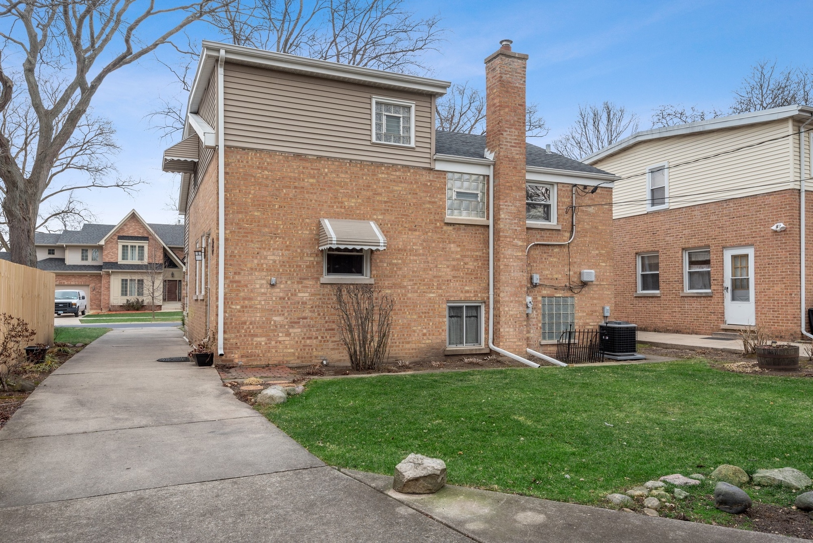 41 Hackberry Lane Glenview, IL 60025 - Photo 20 of 21 a front view of a house with a garden and yard