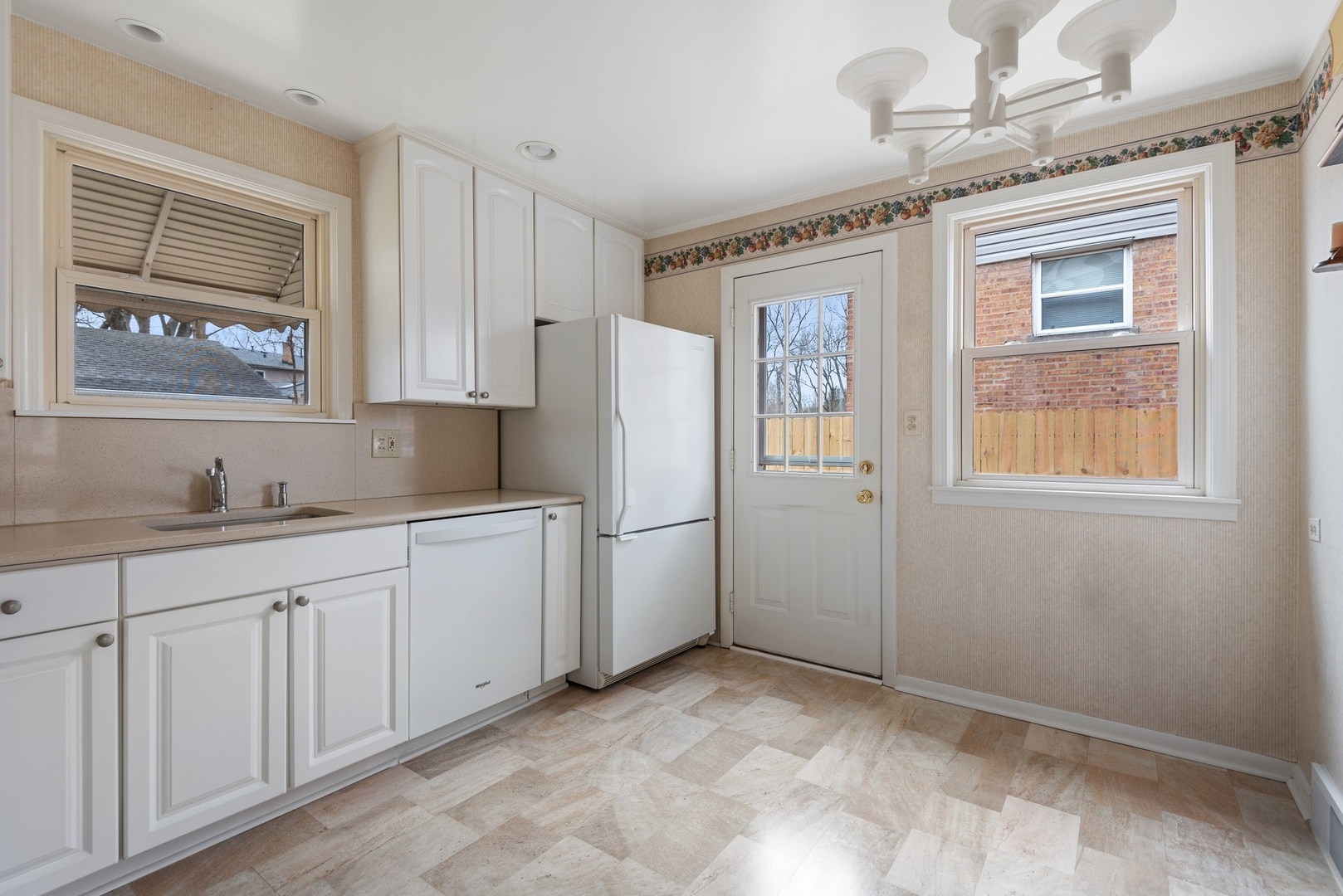41 Hackberry Lane Glenview, IL 60025 - Photo 8 of 21 a kitchen with white cabinets and refrigerator