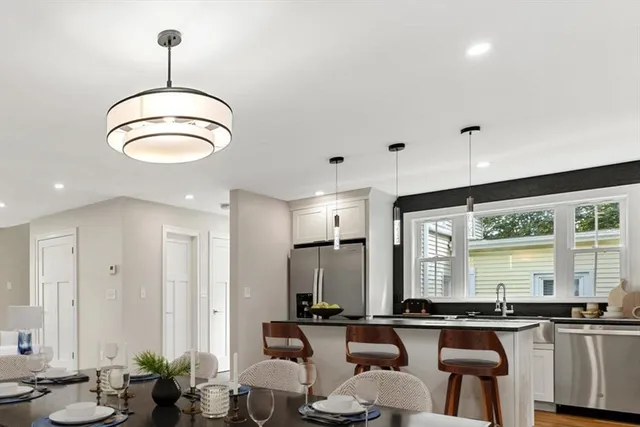 a kitchen with stainless steel appliances granite countertop counter space a sink and cabinets
