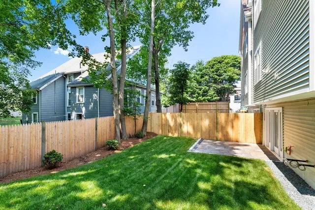 a view of backyard with a garden and plants