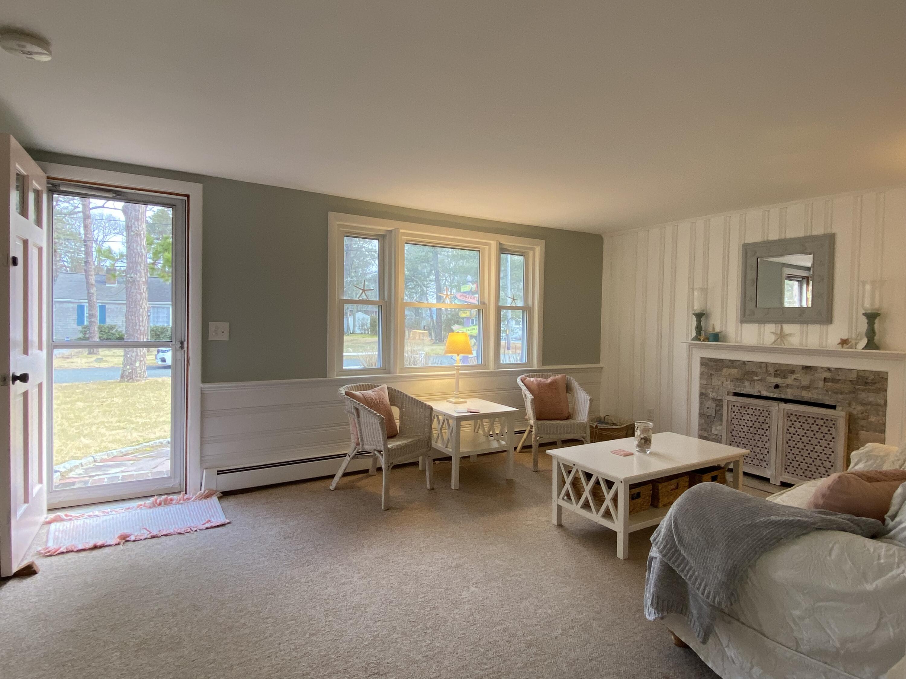 163 Breezy Point Road South Yarmouth, MA 02664 - Photo 11 of 40 a living room with furniture and fireplace
