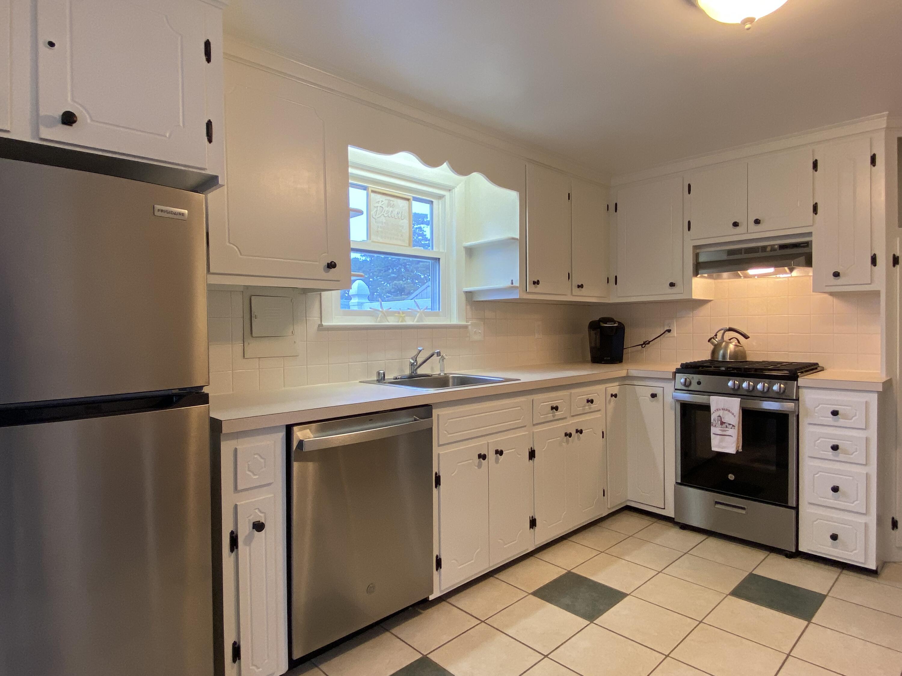 163 Breezy Point Road South Yarmouth, MA 02664 - Photo 15 of 40 a kitchen with granite countertop white cabinets and white appliances