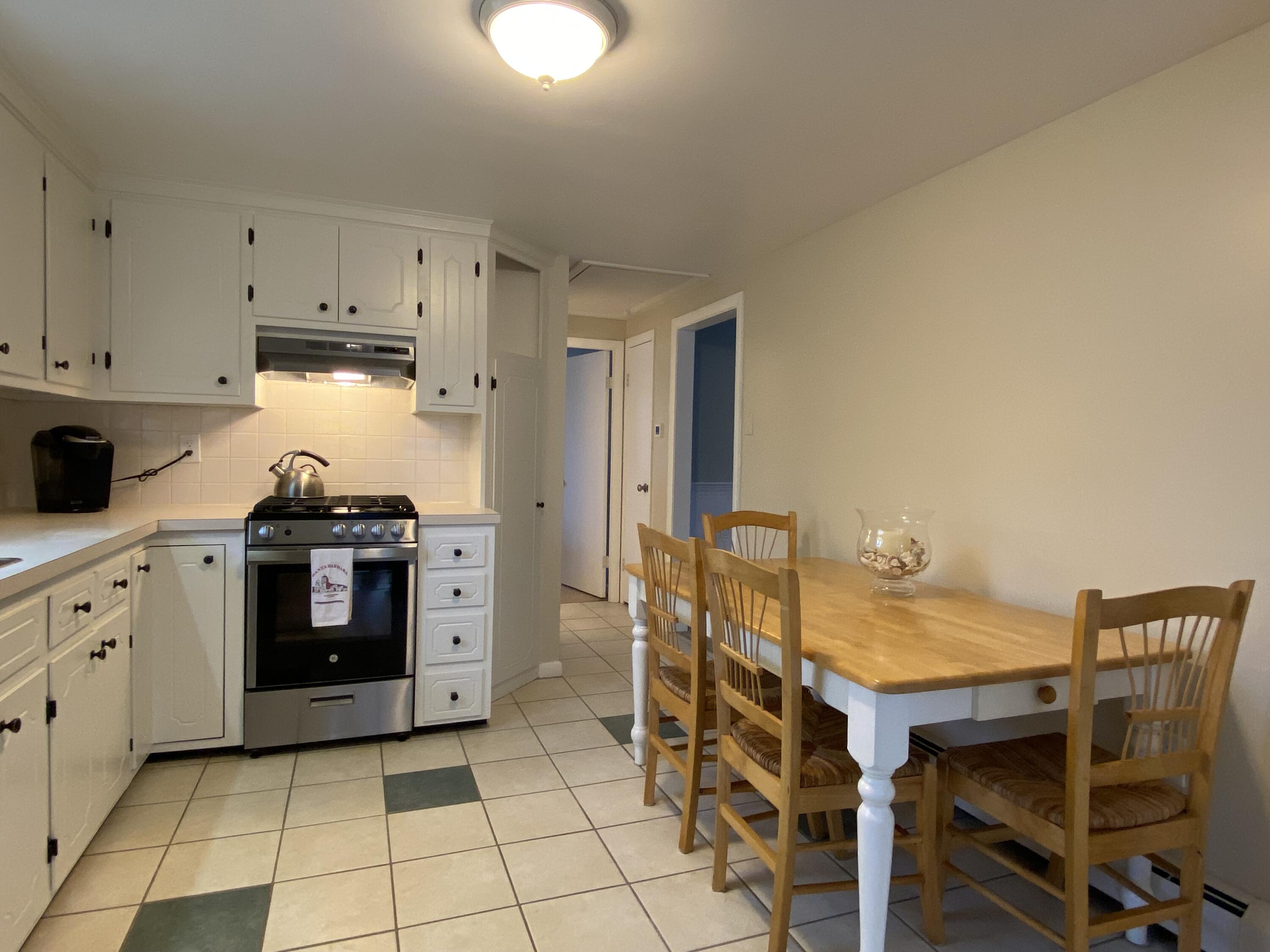 163 Breezy Point Road South Yarmouth, MA 02664 - Photo 17 of 40 a kitchen with a stove and a refrigerator