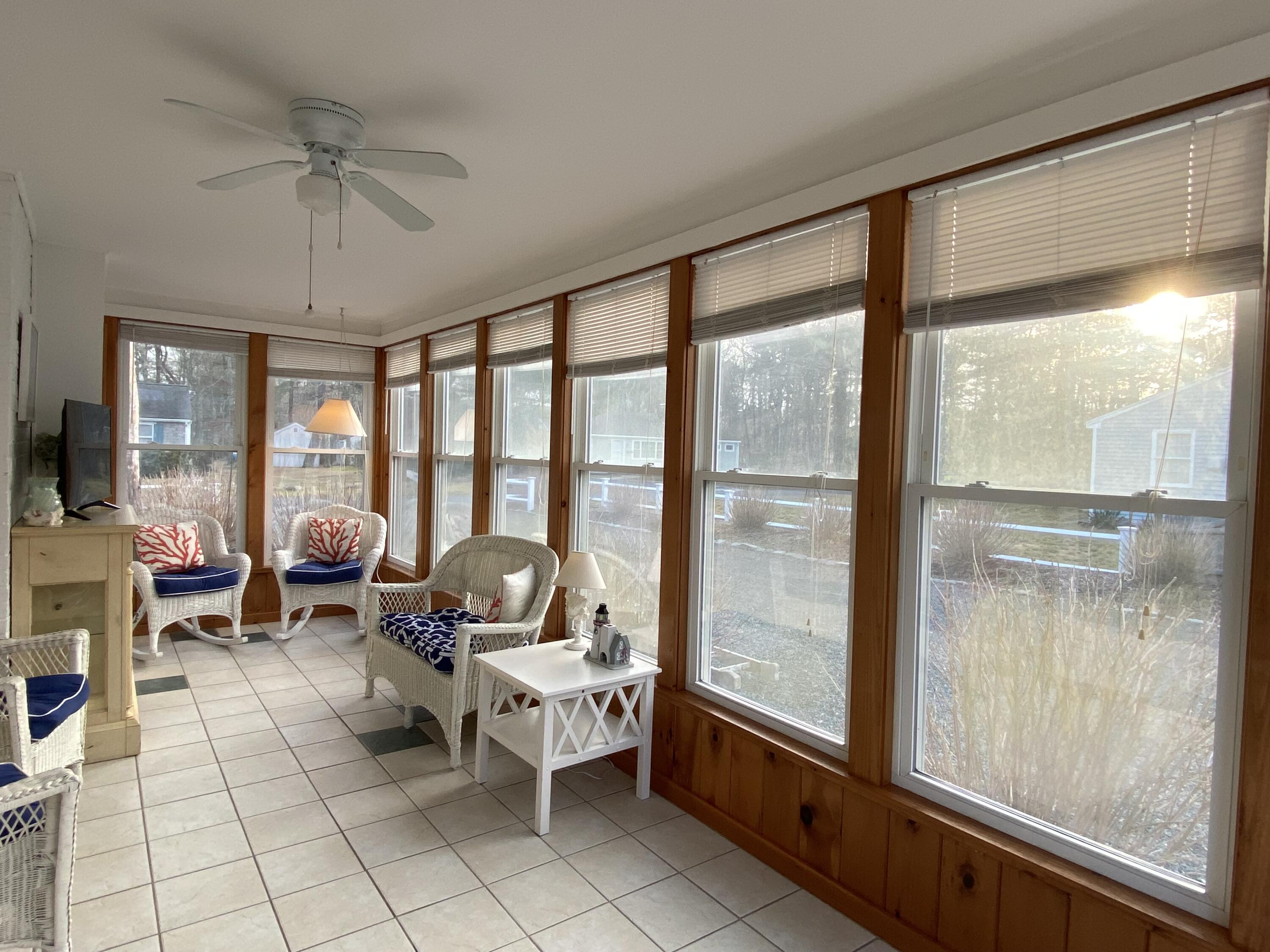 163 Breezy Point Road South Yarmouth, MA 02664 - Photo 19 of 40 a living room with furniture and a large window
