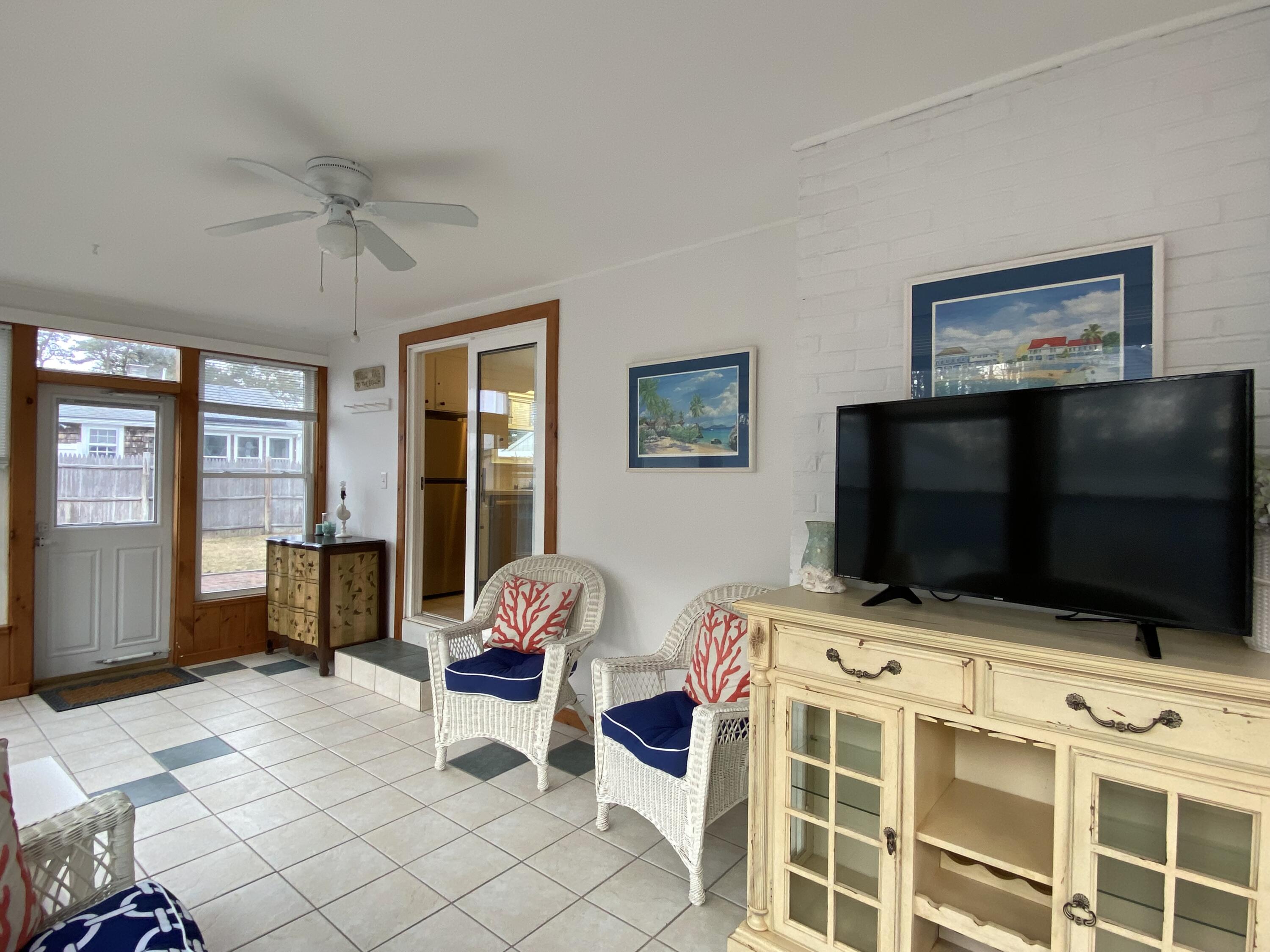 163 Breezy Point Road South Yarmouth, MA 02664 - Photo 21 of 40 a living room with furniture and a flat screen tv