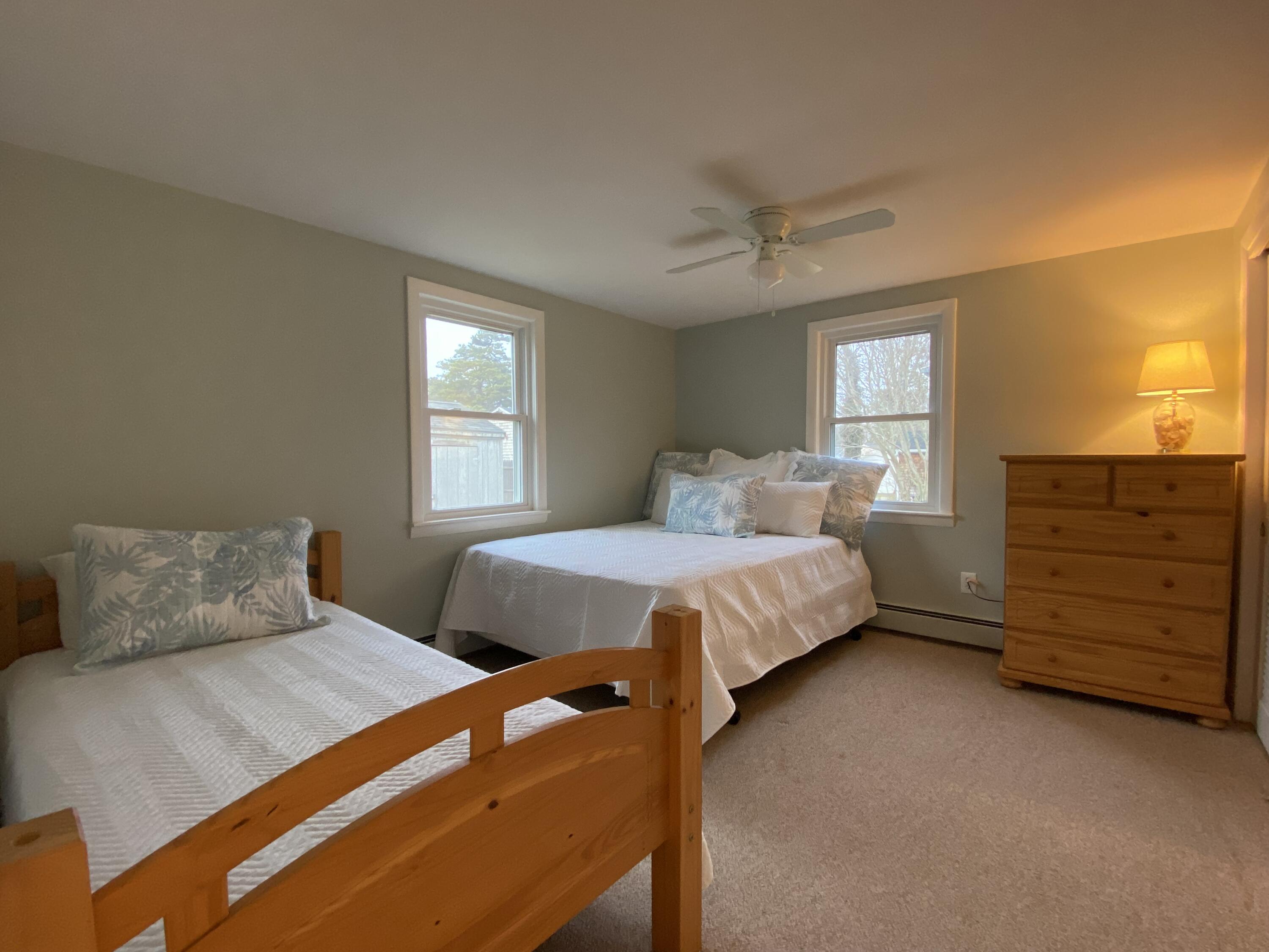 163 Breezy Point Road South Yarmouth, MA 02664 - Photo 27 of 40 a bedroom with a bed and a dresser