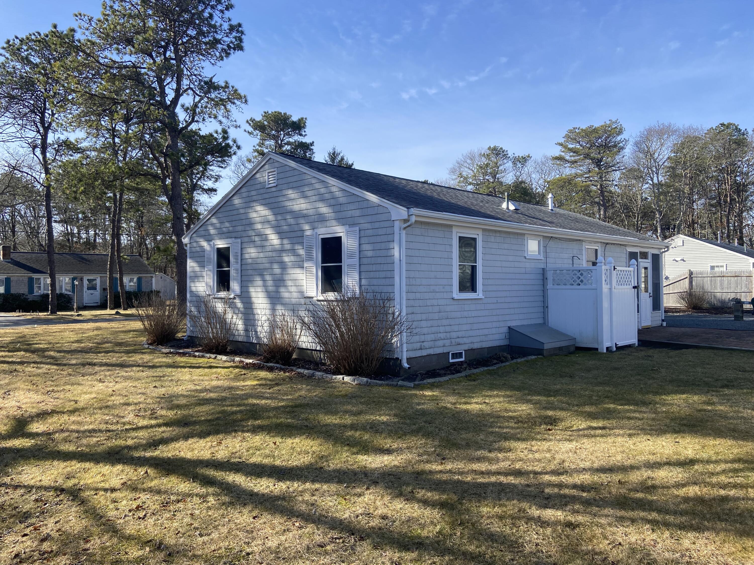 163 Breezy Point Road South Yarmouth, MA 02664 - Photo 3 of 40 a view of a house with a swimming pool