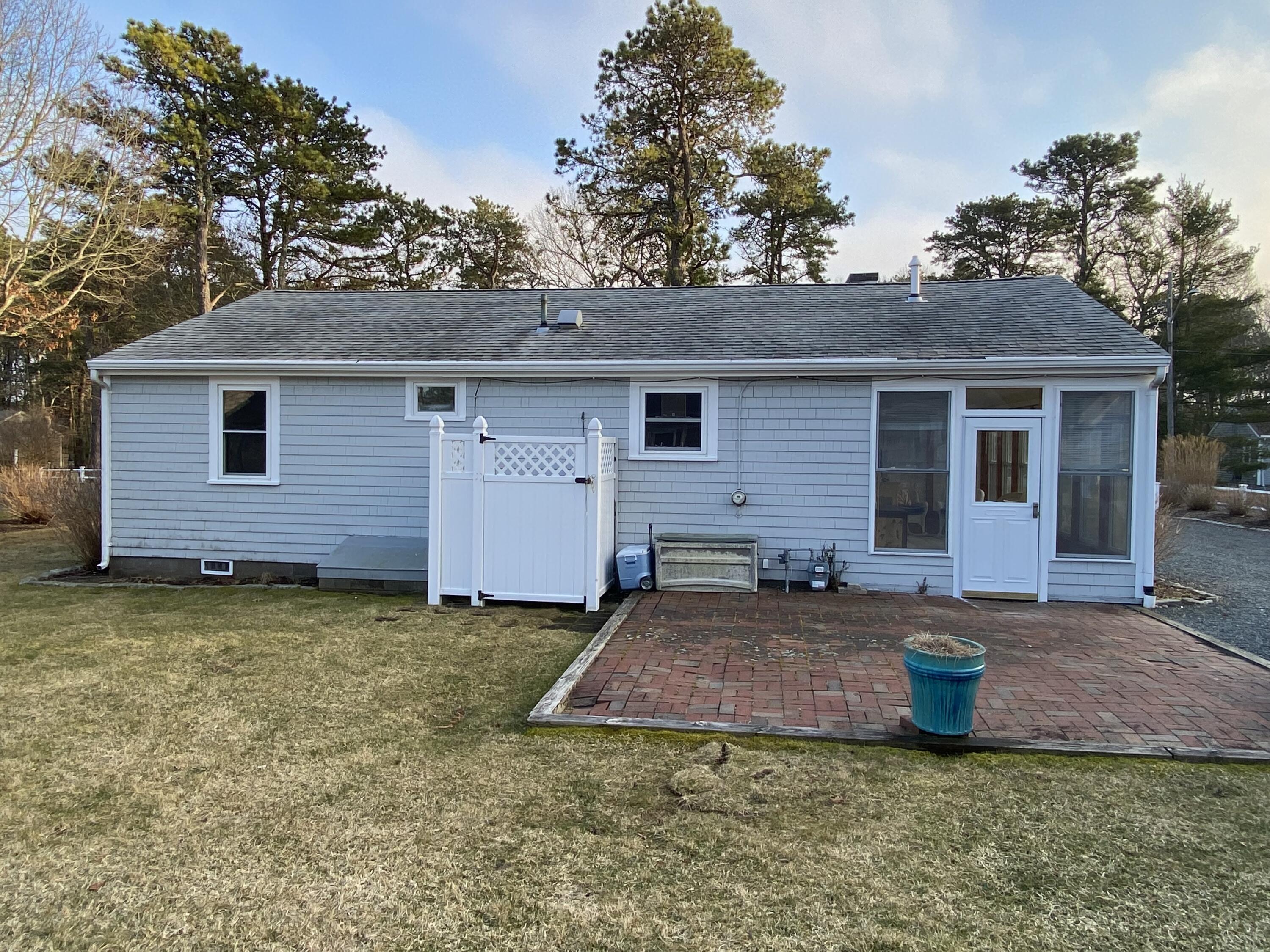 163 Breezy Point Road South Yarmouth, MA 02664 - Photo 34 of 40 a view of a house with backyard and trees