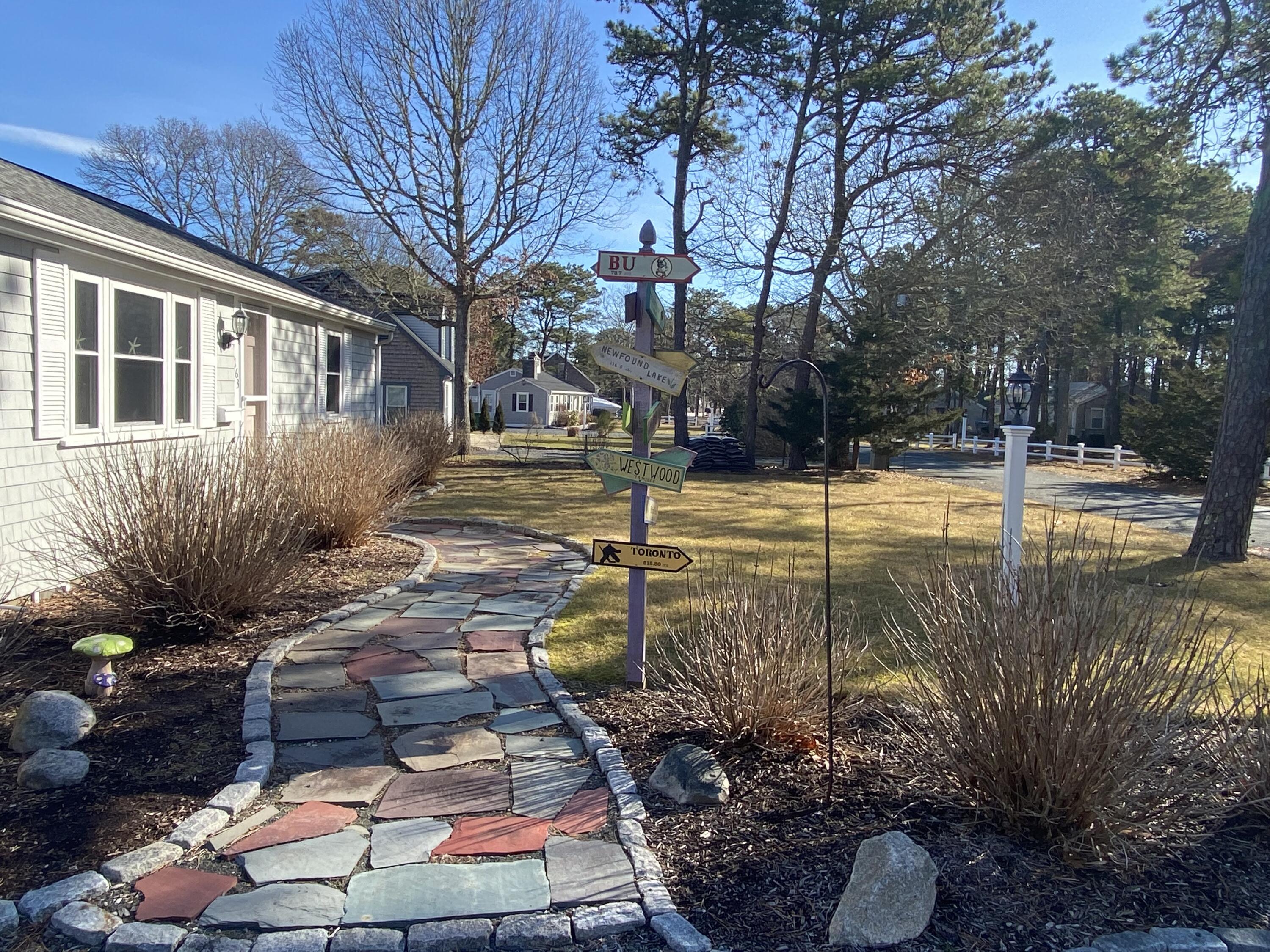 163 Breezy Point Road South Yarmouth, MA 02664 - Photo 4 of 40 a view of a yard with plants