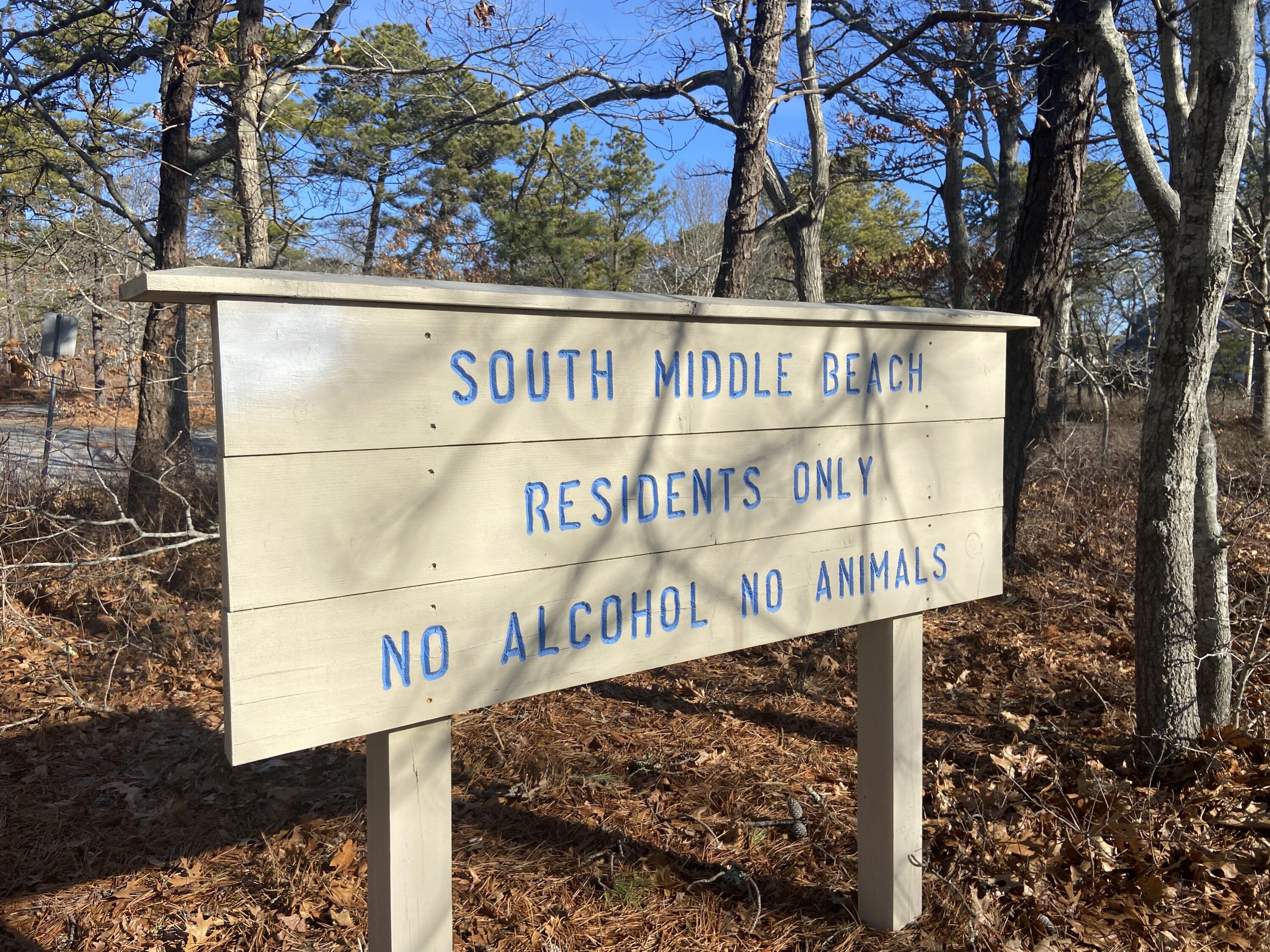 163 Breezy Point Road South Yarmouth, MA 02664 - Photo 5 of 40 a street sign that is on a pole