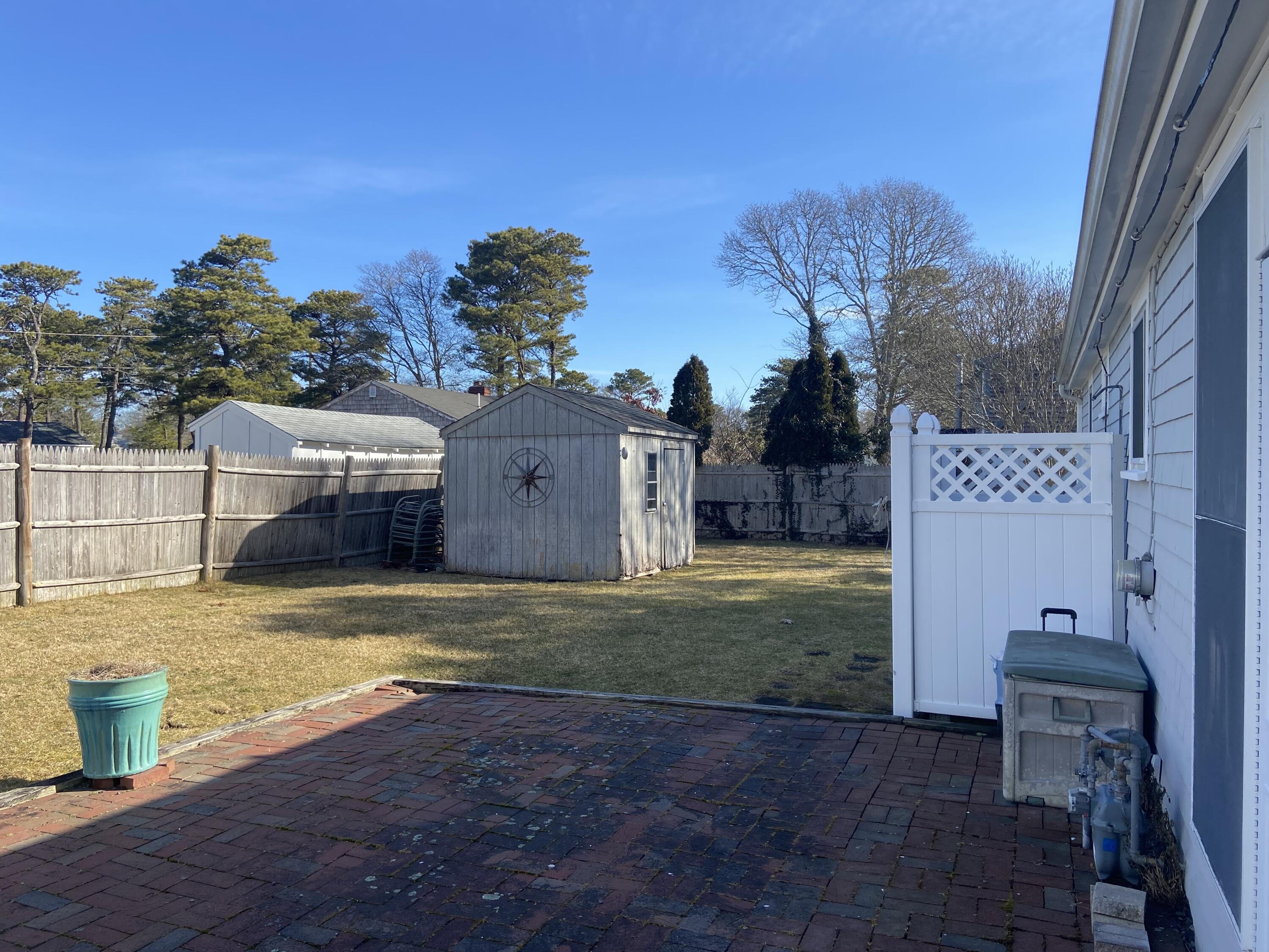 163 Breezy Point Road South Yarmouth, MA 02664 - Photo 9 of 40 a view of a house with backyard
