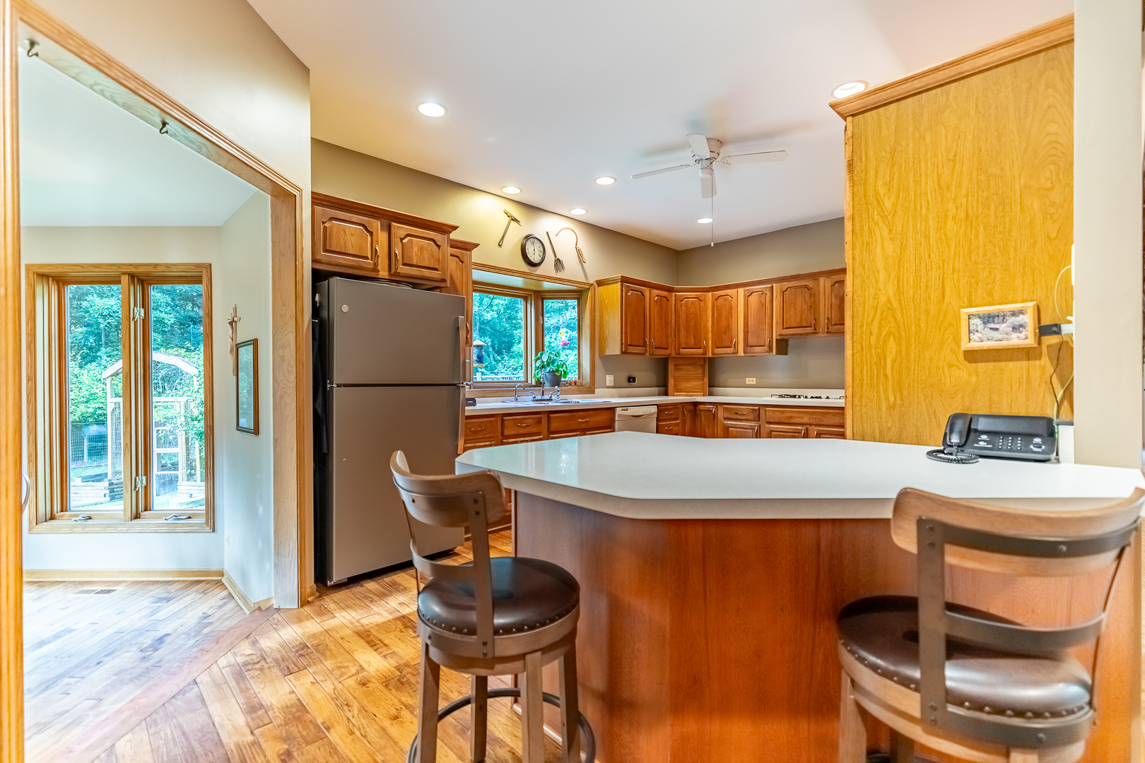 3530 East Challas Entrance Crete, IL 60417 - Photo 18 of 60 a kitchen with stainless steel appliances granite countertop a sink and a refrigerator