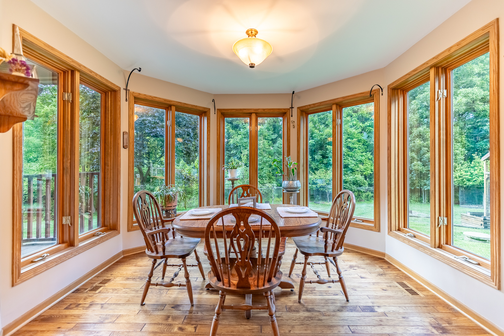 3530 East Challas Entrance Crete, IL 60417 - Photo 20 of 60 a view of a dining room with furniture large windows and wooden floor