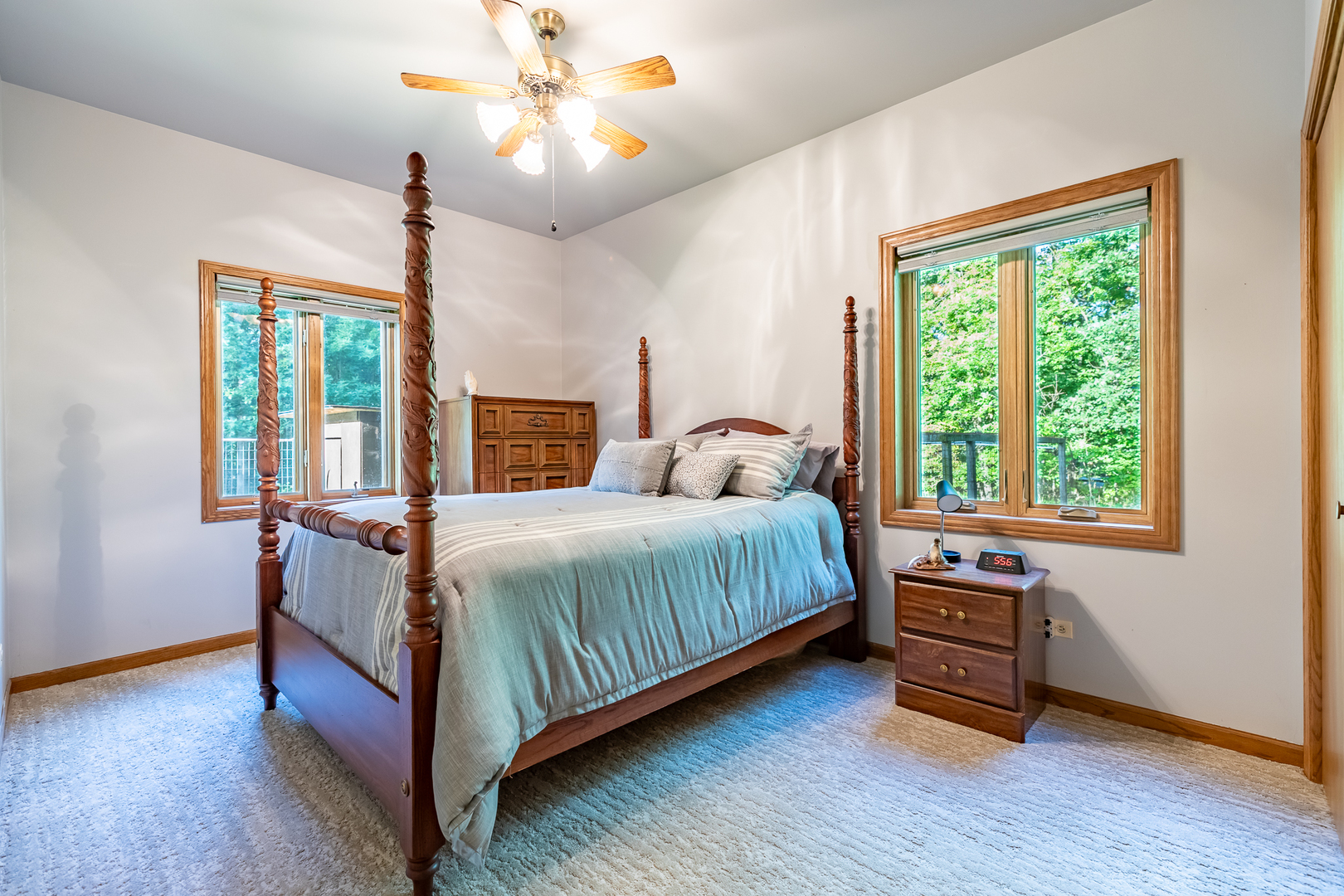 3530 East Challas Entrance Crete, IL 60417 - Photo 21 of 60 a bedroom with a bed and a chandelier