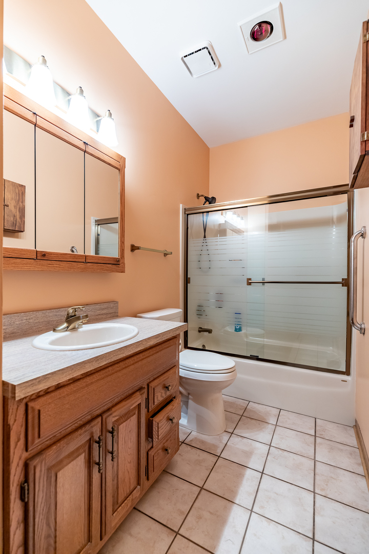 3530 East Challas Entrance Crete, IL 60417 - Photo 22 of 60 a bathroom with a sink a toilet and shower