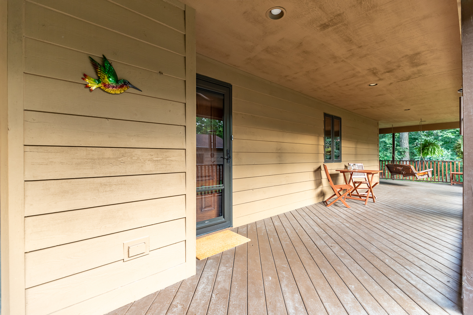 3530 East Challas Entrance Crete, IL 60417 - Photo 41 of 60 a view of a balcony with chairs and wooden floor