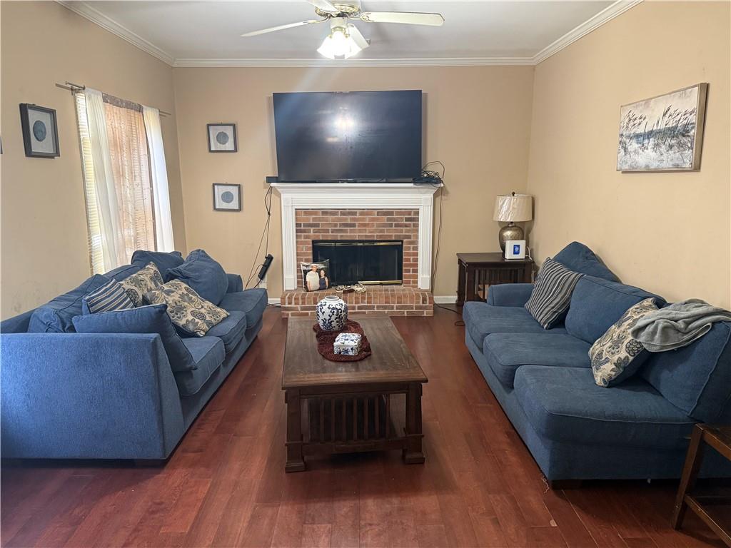 2390 Walnut Grove Way Suwanee, GA 30024 - Photo 13 of 22 a living room with furniture and a fireplace