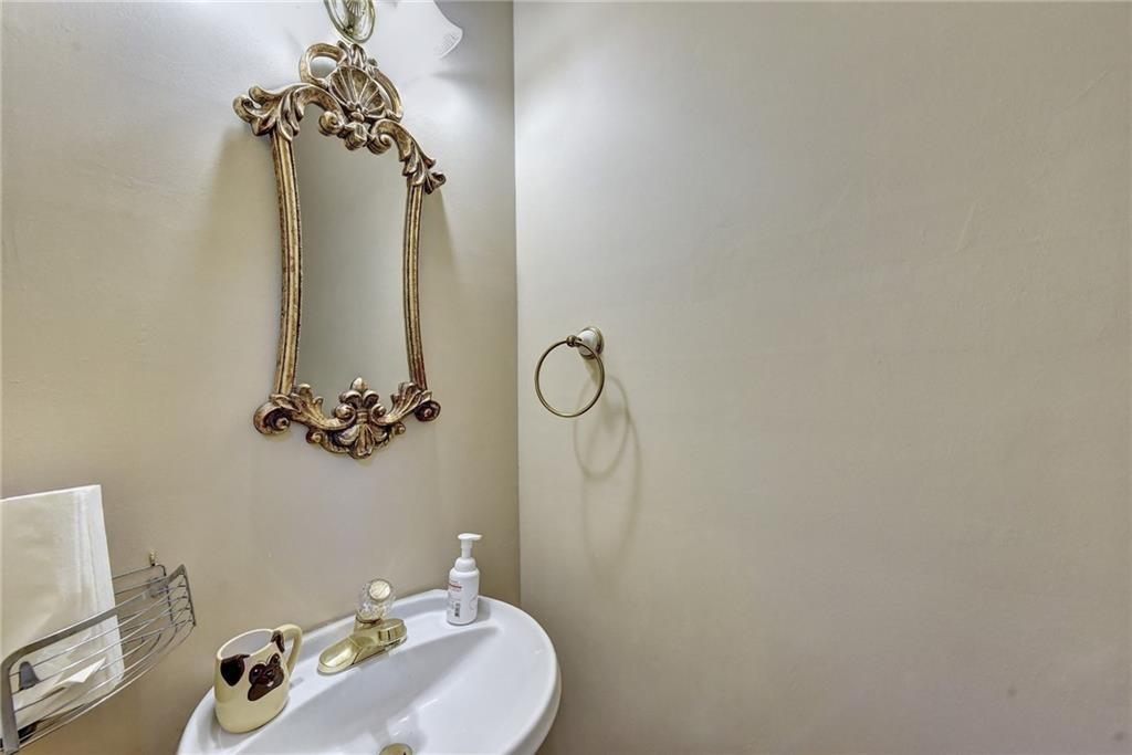2390 Walnut Grove Way Suwanee, GA 30024 - Photo 14 of 22 a bathroom with a sink and mirror with vanity