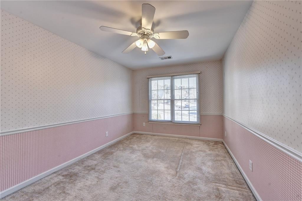 2390 Walnut Grove Way Suwanee, GA 30024 - Photo 16 of 22 a view of an empty room with a window