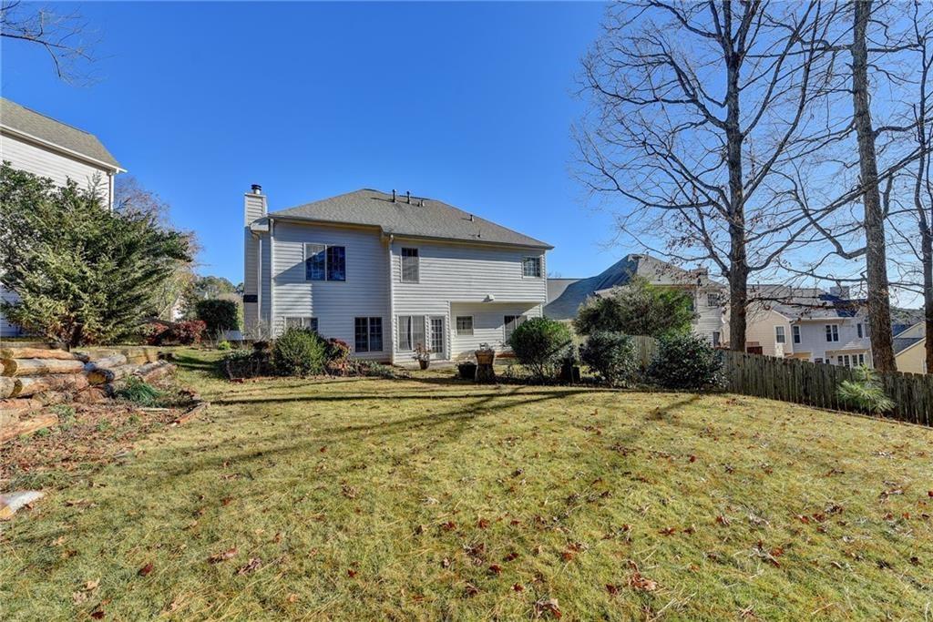 2390 Walnut Grove Way Suwanee, GA 30024 - Photo 20 of 22 a front view of a house with a yard