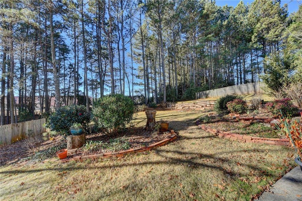 2390 Walnut Grove Way Suwanee, GA 30024 - Photo 21 of 22 a view of a backyard of the house