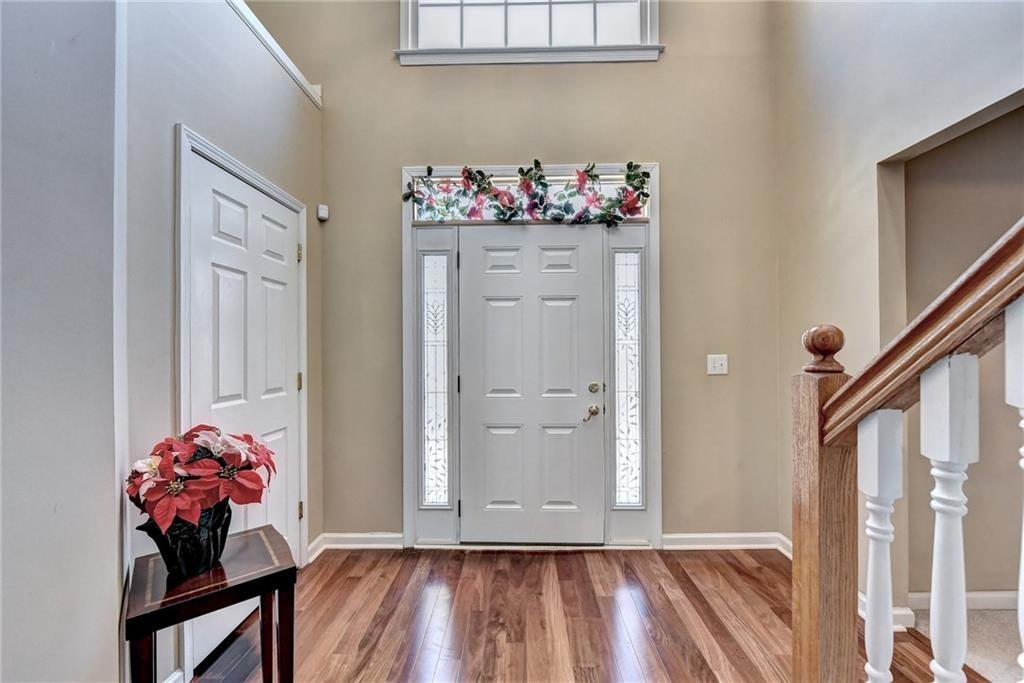 2390 Walnut Grove Way Suwanee, GA 30024 - Photo 6 of 22 a view of room with wooden floor and toys
