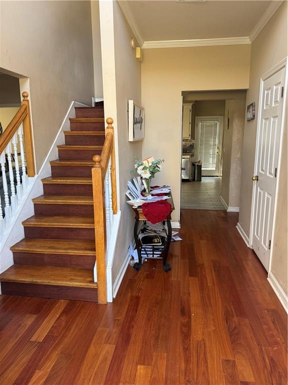 2390 Walnut Grove Way Suwanee, GA 30024 - Photo 7 of 22 a view of entryway and hall with wooden floor