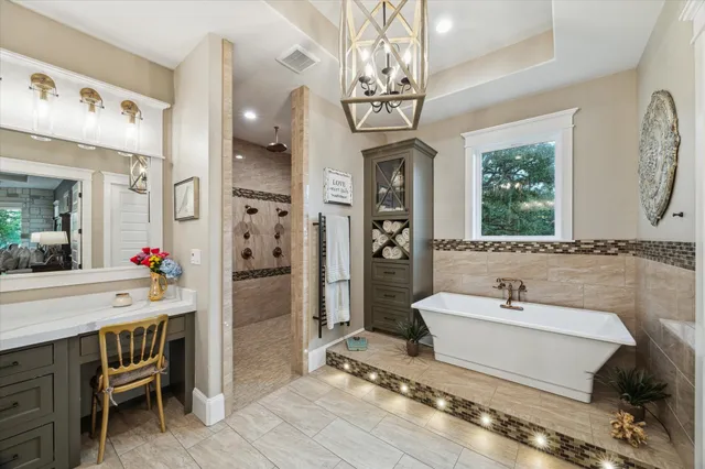 a spacious bathroom with a granite countertop sink mirror and a shower