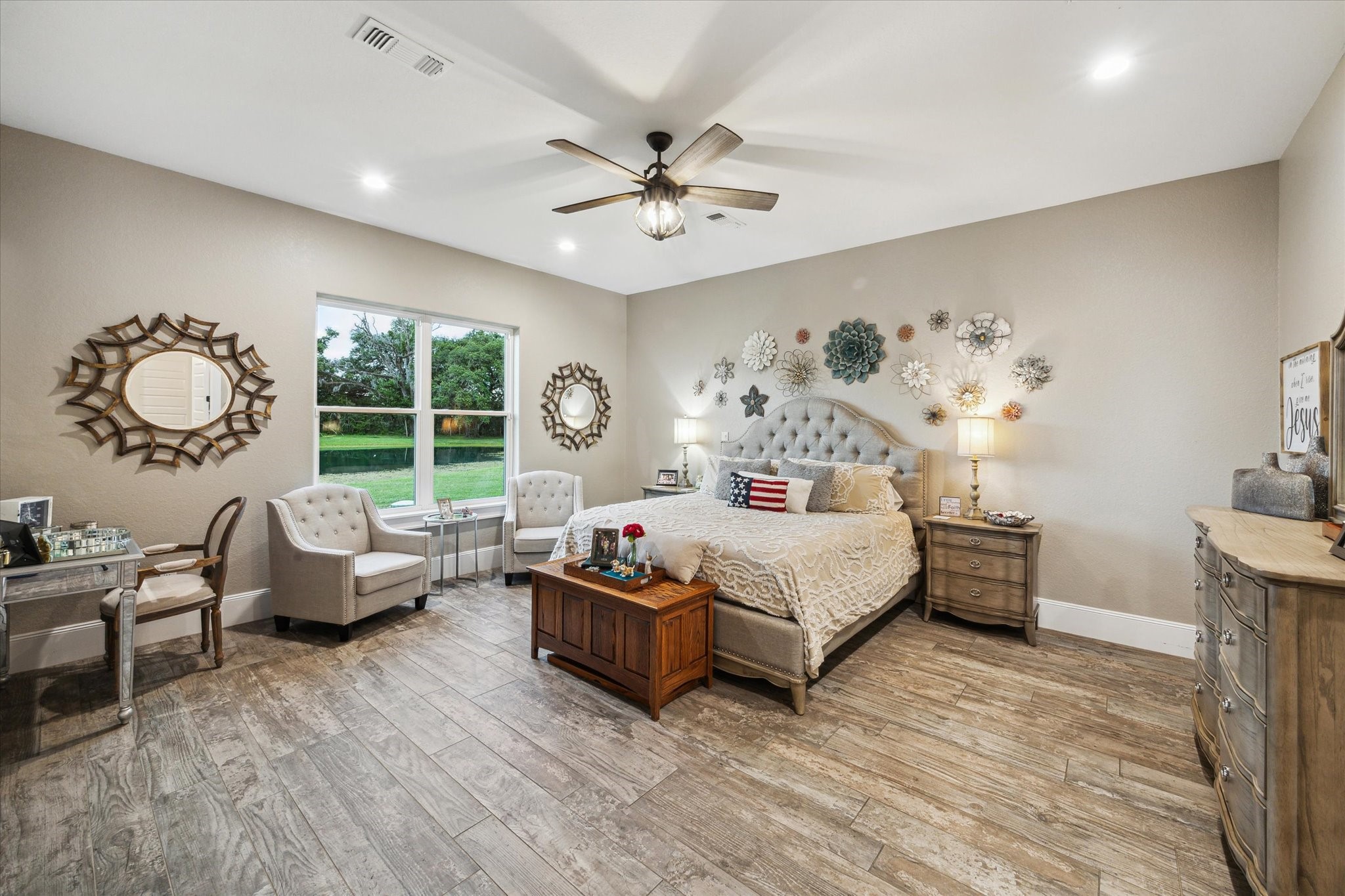 1255 Bronco Trail Angleton, TX 77515 - Photo 37 of 50 a bedroom with a large bed and a chandelier