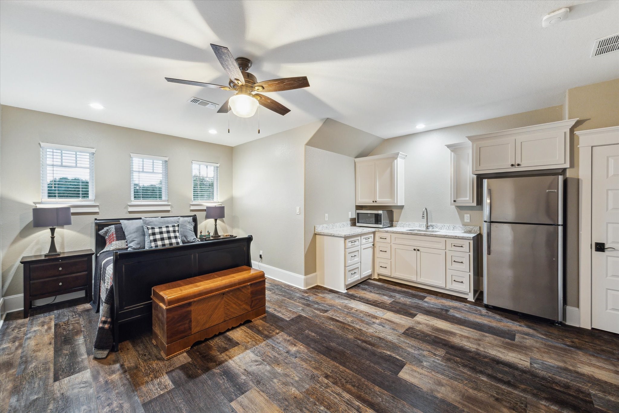 1255 Bronco Trail Angleton, TX 77515 - Photo 40 of 50 a kitchen with a refrigerator cabinets and furniture