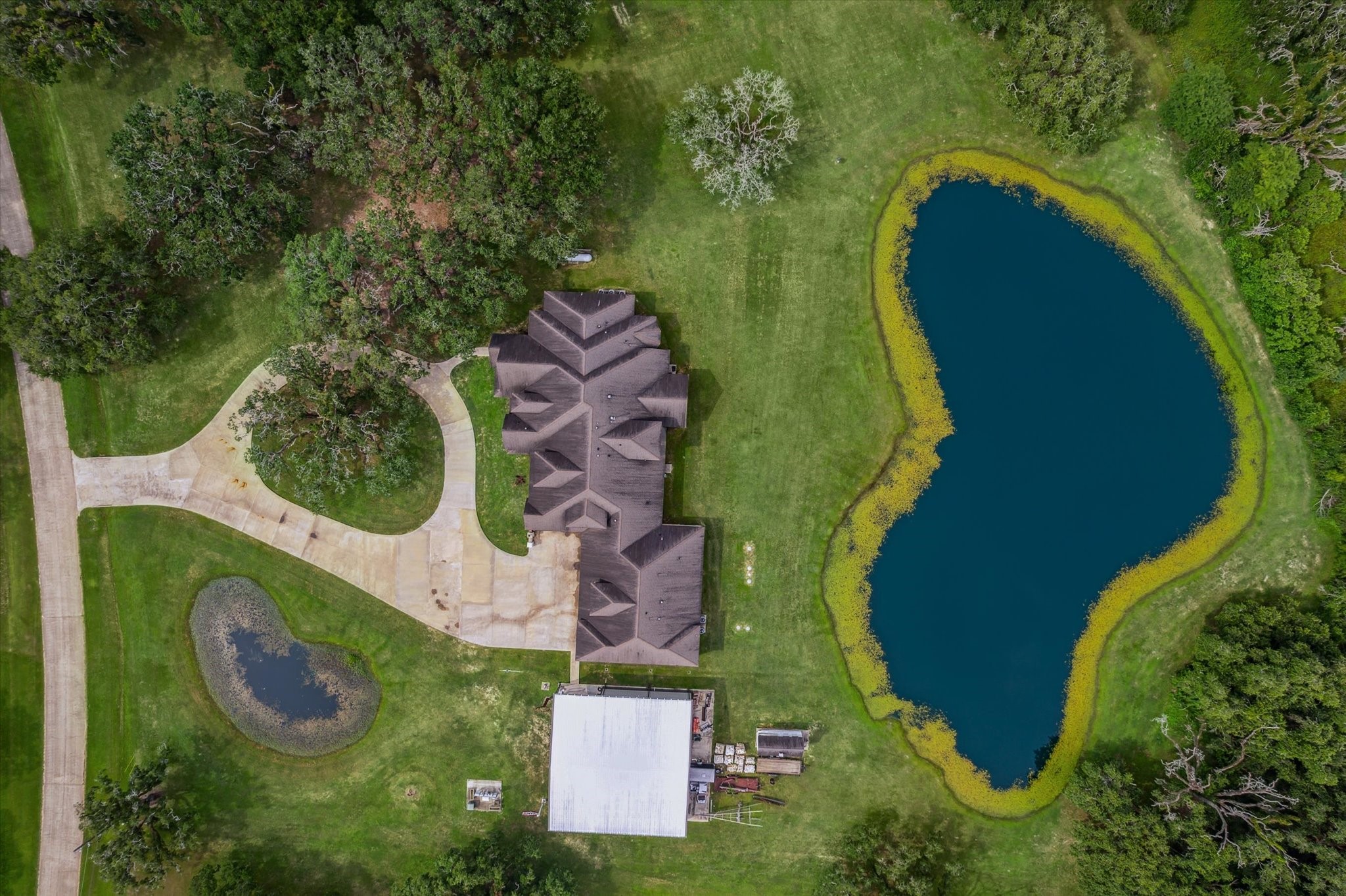 1255 Bronco Trail Angleton, TX 77515 - Photo 46 of 50 an aerial view of a house with outdoor space and a swimming pool