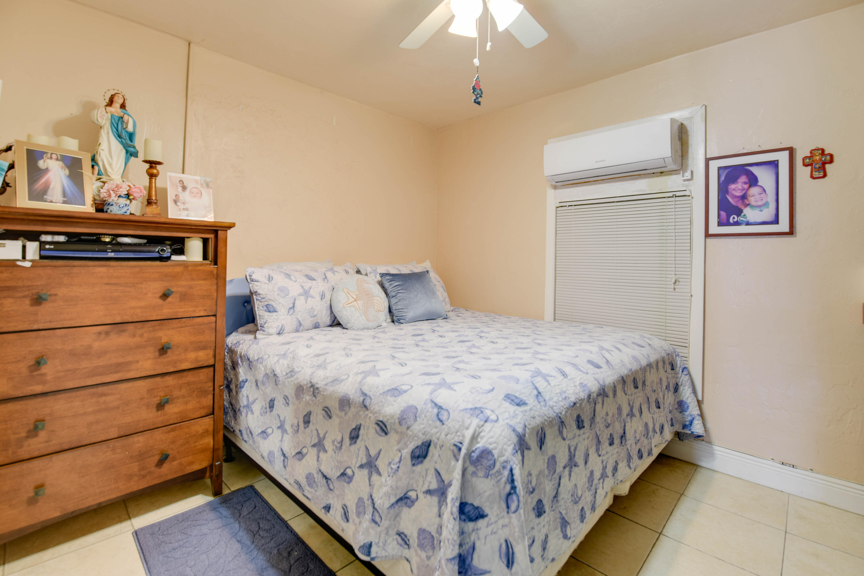 1524 5th Street Key West, FL 33040 - Photo 19 of 31 a bedroom with a bed and a chandelier