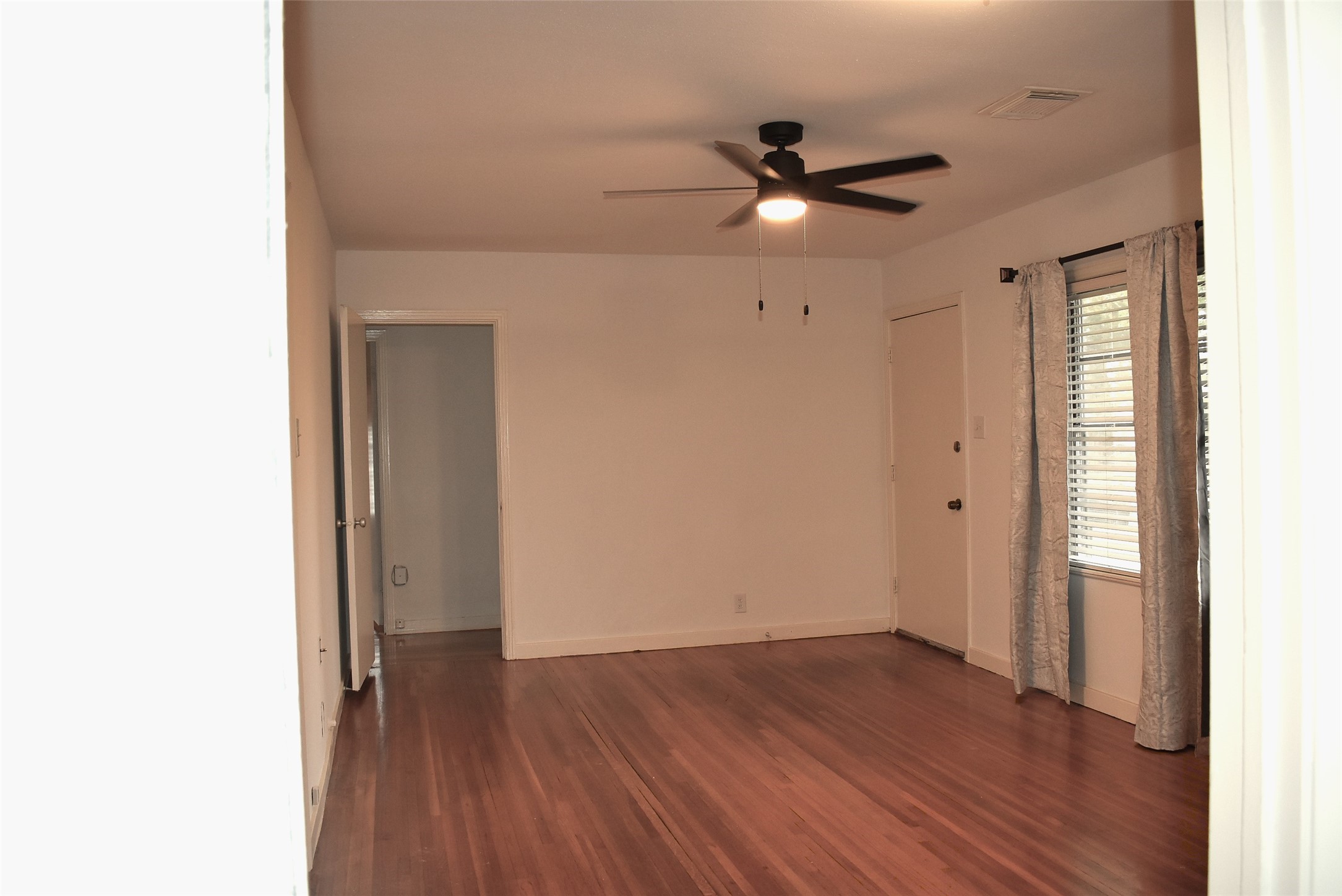 1006 Mac Drive Sweeny, TX 77480 - Photo 20 of 43 a view of an empty room with wooden floor