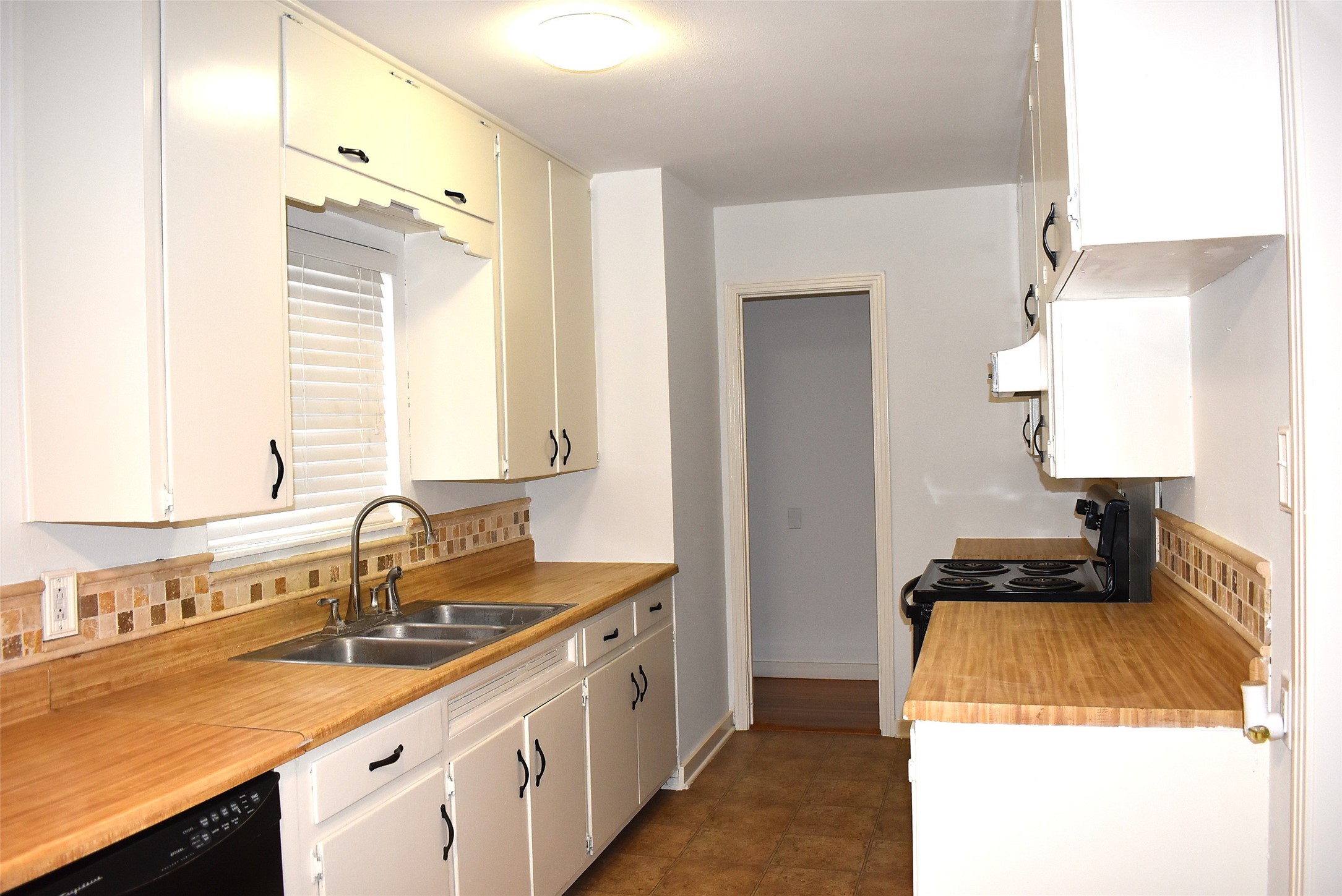 1006 Mac Drive Sweeny, TX 77480 - Photo 21 of 43 a kitchen with a sink and a stove