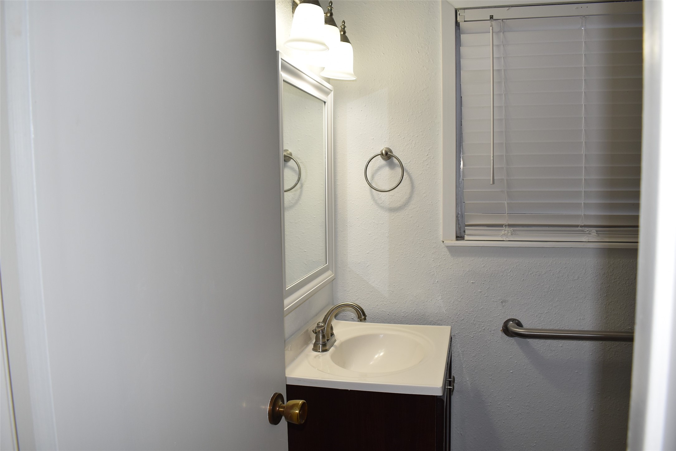 1006 Mac Drive Sweeny, TX 77480 - Photo 31 of 43 a bathroom with a sink and a mirror