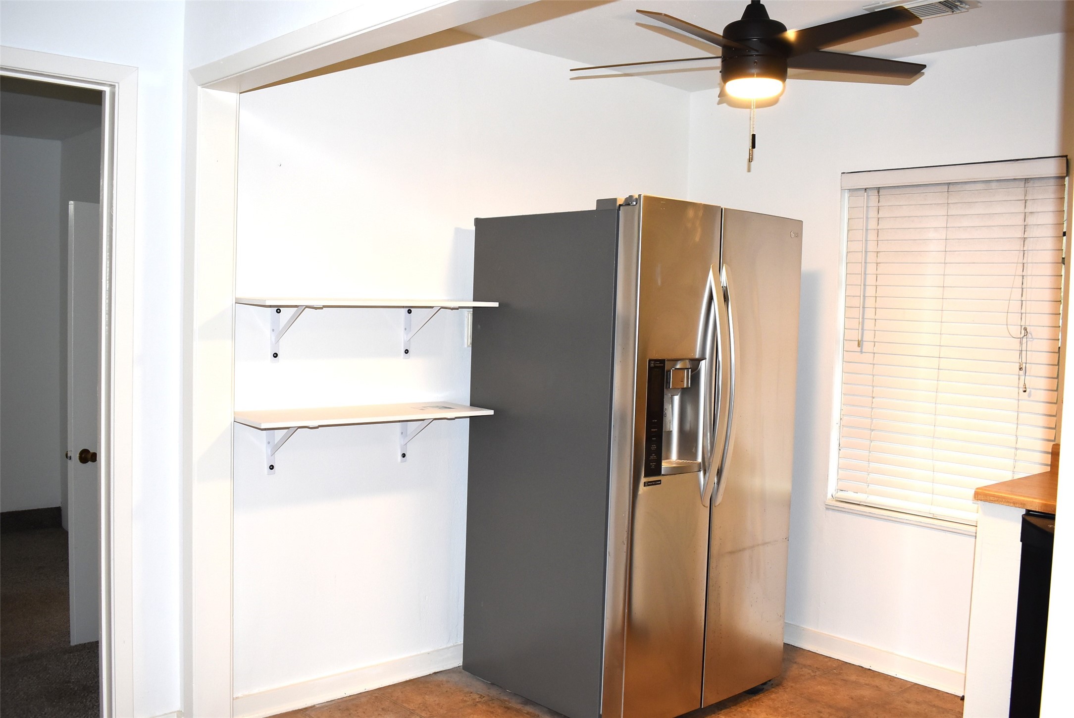 1006 Mac Drive Sweeny, TX 77480 - Photo 38 of 43 a white refrigerator freezer sitting inside of a kitchen