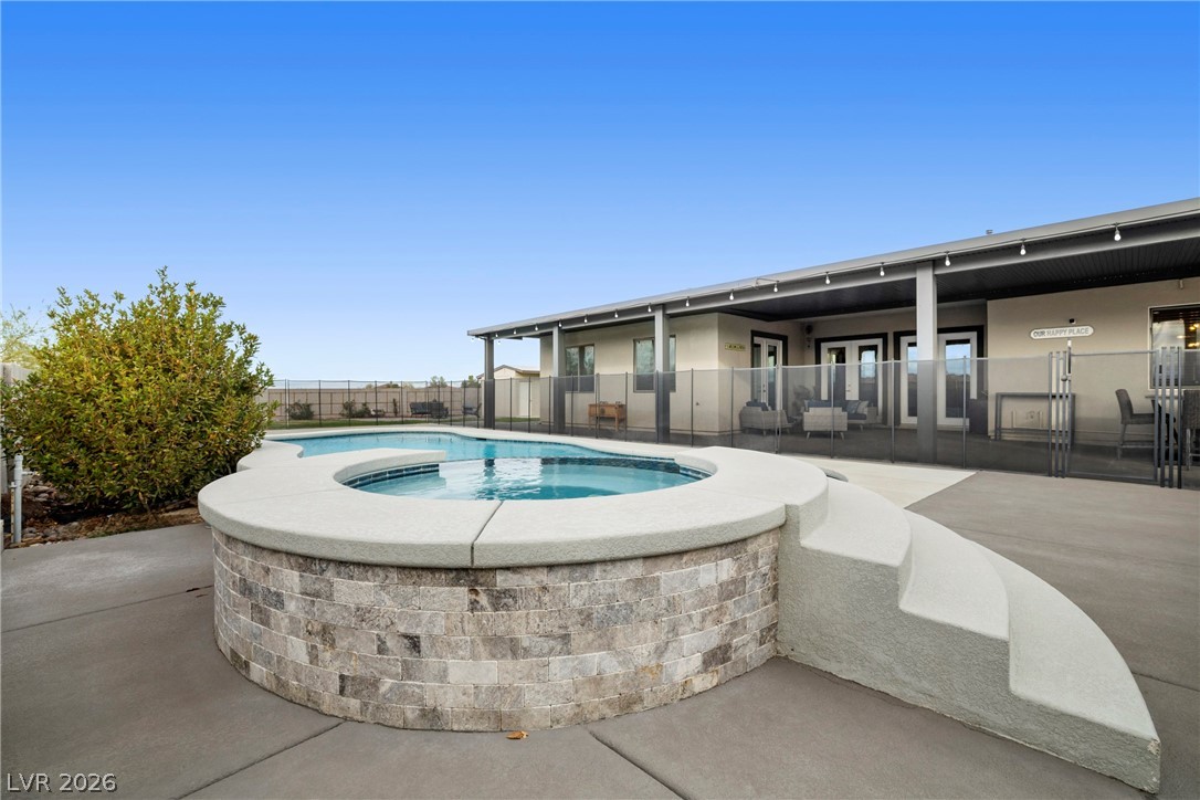 432 North Racetrack Road Henderson, NV 89015 - Photo 17 of 45 View of pool featuring patio surround and an outdoor hot tub