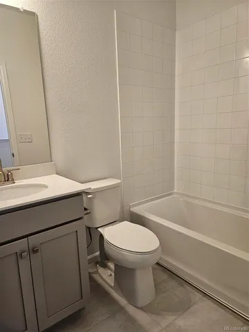 a bathroom with a sink a toilet and a bathtub