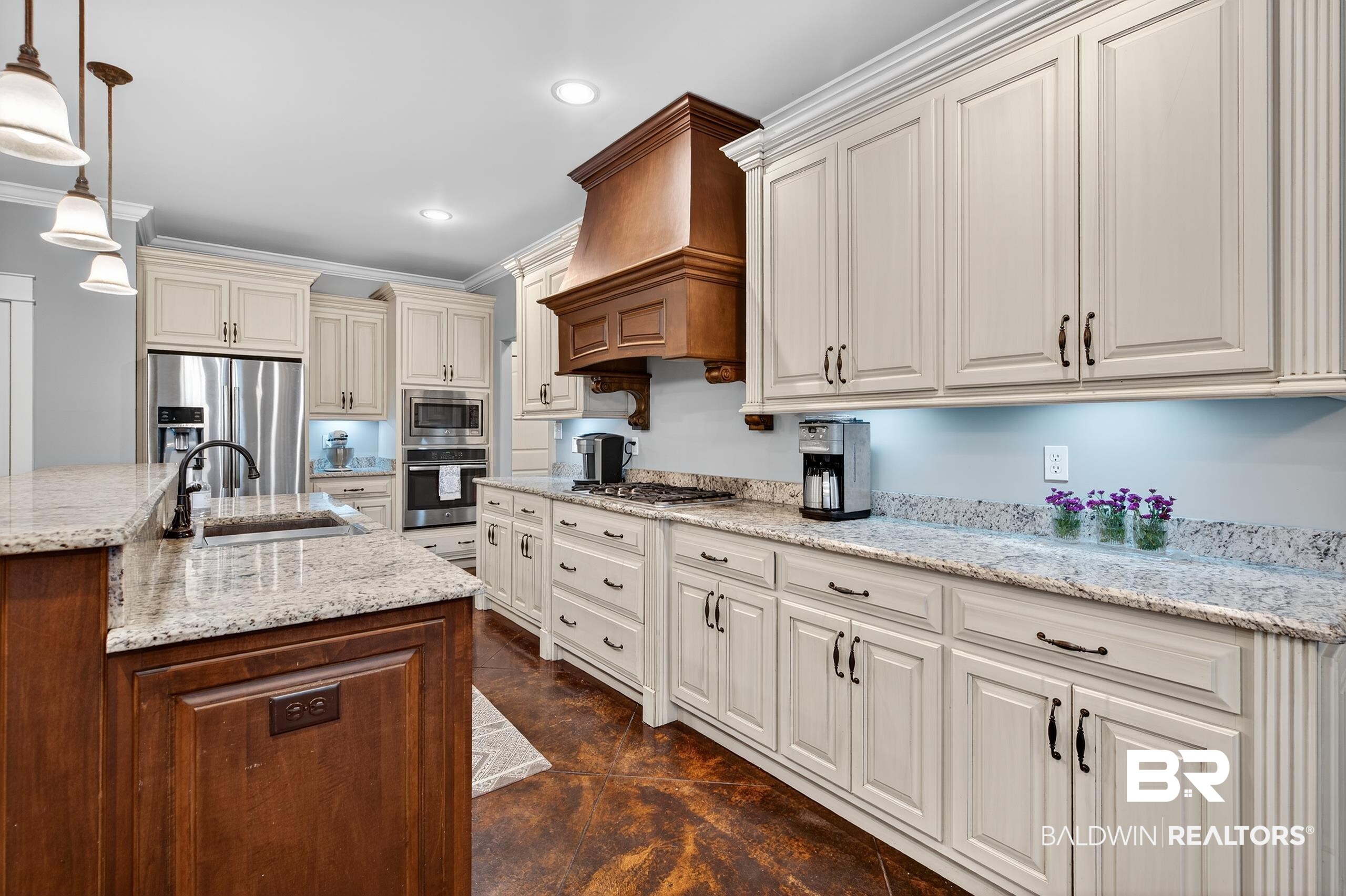 5517 Rabbit Creek Drive Theodore, AL 36582 - Photo 4 of 33 Kitchen featuring cream cabinets, light stone countertops, decorative light fixtures, stainless steel appliances, and crown molding