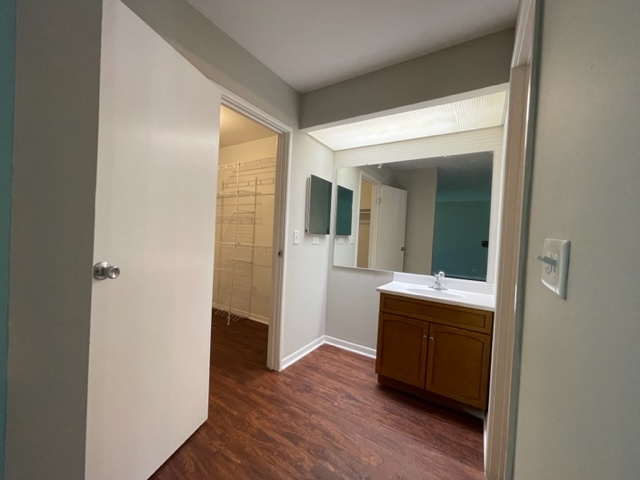 529 Jordan Way Bolingbrook, IL 60440 - Photo 14 of 23 a room with a mirror and a wooden floor
