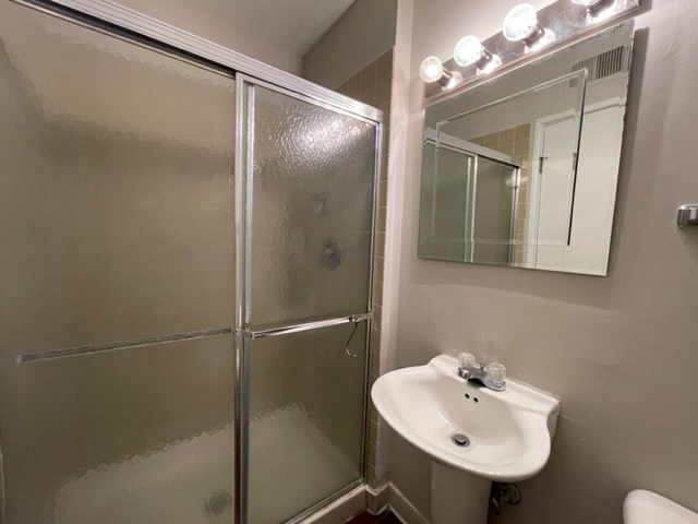 529 Jordan Way Bolingbrook, IL 60440 - Photo 16 of 23 a bathroom with a sink mirror and a shower